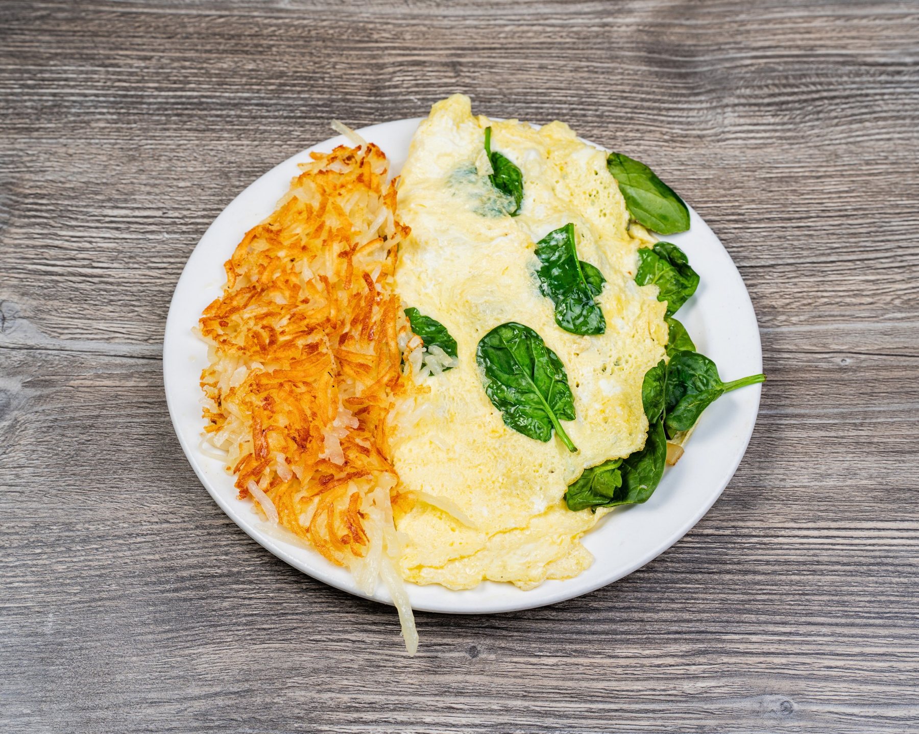 Spinach omelette with hash browns
