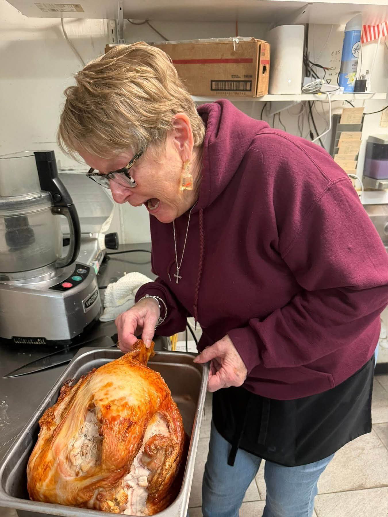 Diane checking a whole roasted turkey